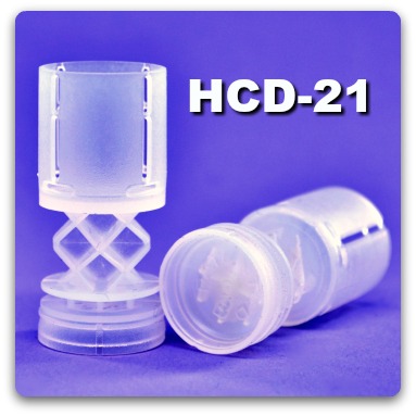 Close-up of two Helix Cushion Driver-21 12 gauge wads.