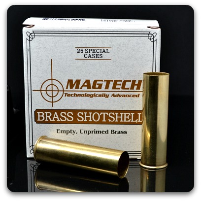 Close up of a box of Magtech brass hulls and two brass hulls